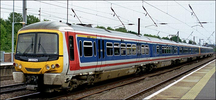 West Anglia Great Northern class 365521 at Hitchin station on up fast in 2004.