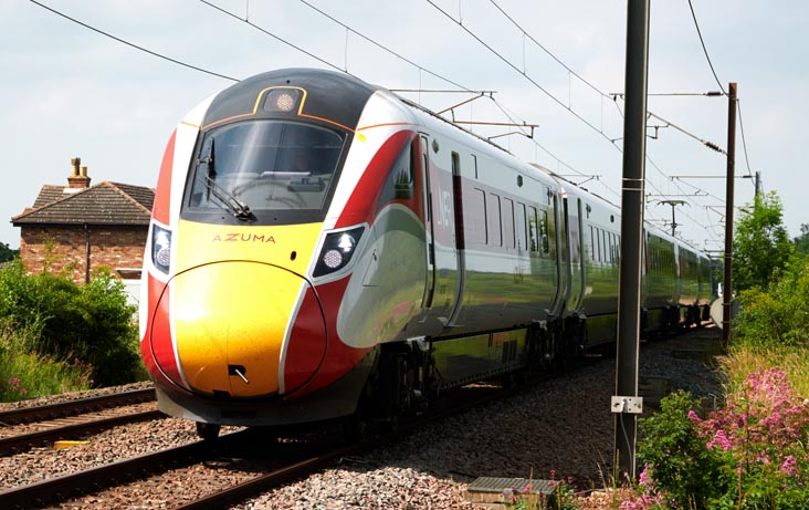 LNER Azuma at Holme level crossing on an up train to London on the 2nd July in 2021
