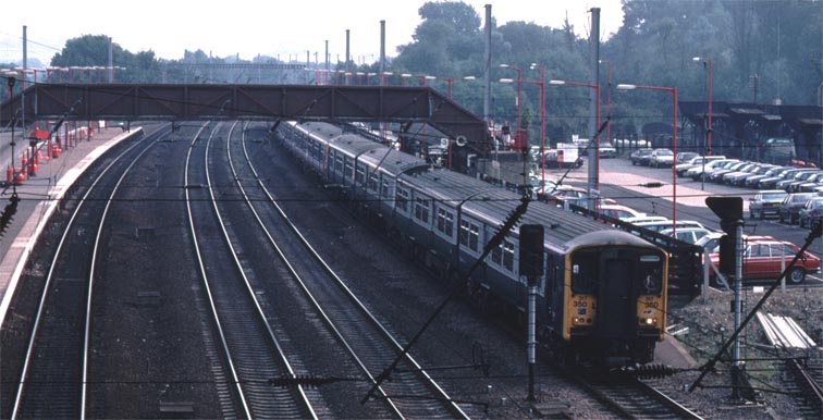 Class 317 350 in platform 3 at Huntingdon with a Peterborough train