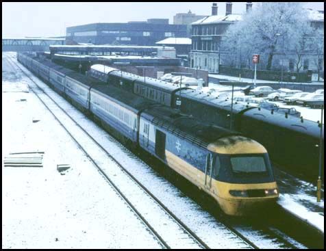 Platform one is full of parcel and mail vans as a HST to London waits in platform 2 at Peterborough railway station