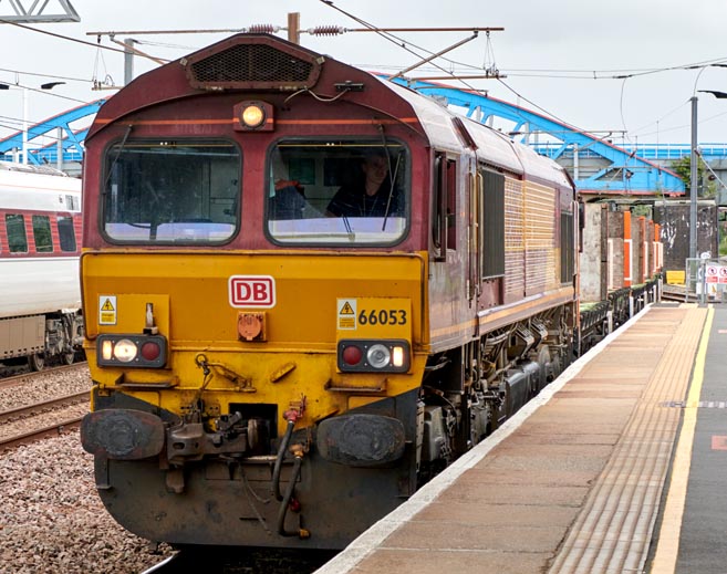 DB class 66053 into Peterborough platform 4 on 12th August  in 2021 
