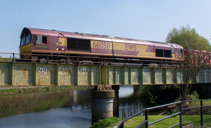 DB class 66050 on the March line on the River Nene bridge 