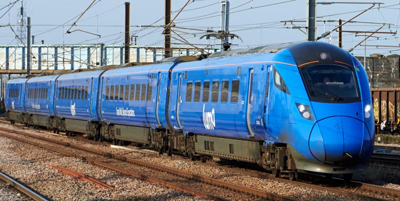 Peterborough station with an Lumo 5 car train on the up fast on 15th Febuary in 2023
