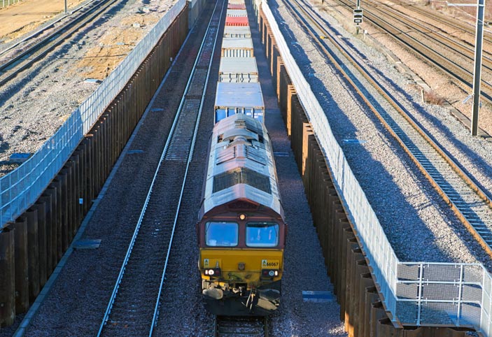 DB class 66067 using the new Dive under at Werrington on up train on the 17th January 2022