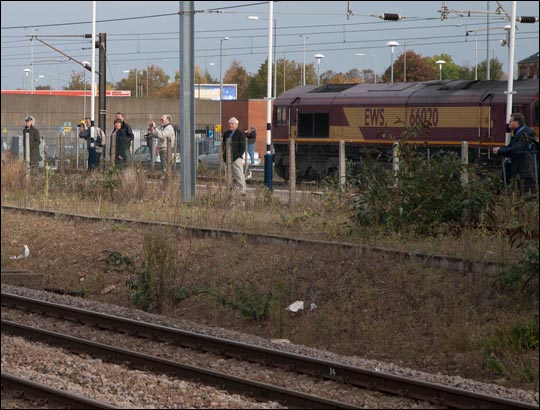 Some railway photograthers wait on the old platform 3 for a steam train