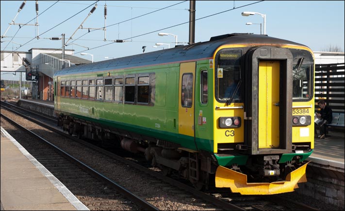 Class 153384 in platform 2 at Peterborough railway station on the 29th of March 2012