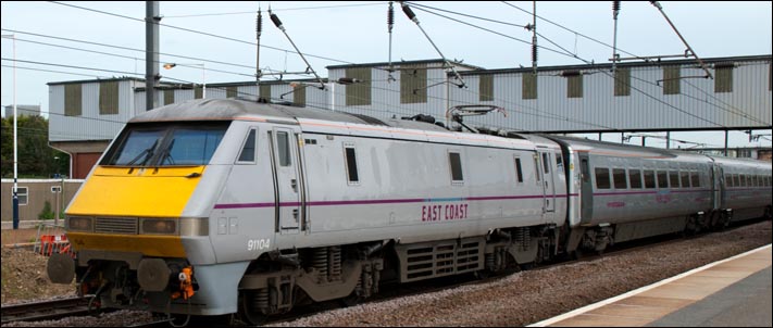 East Coast class 91104 on the down fast at Peterborough station on the 17th of June 2013 East Coast class 91104 on the down fast at Peterborough station on the 17th of June 2013