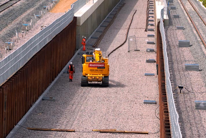  Rails  for new dive under track being draged from the other end of the dive under at Werrington on 5th ofJuly 2021